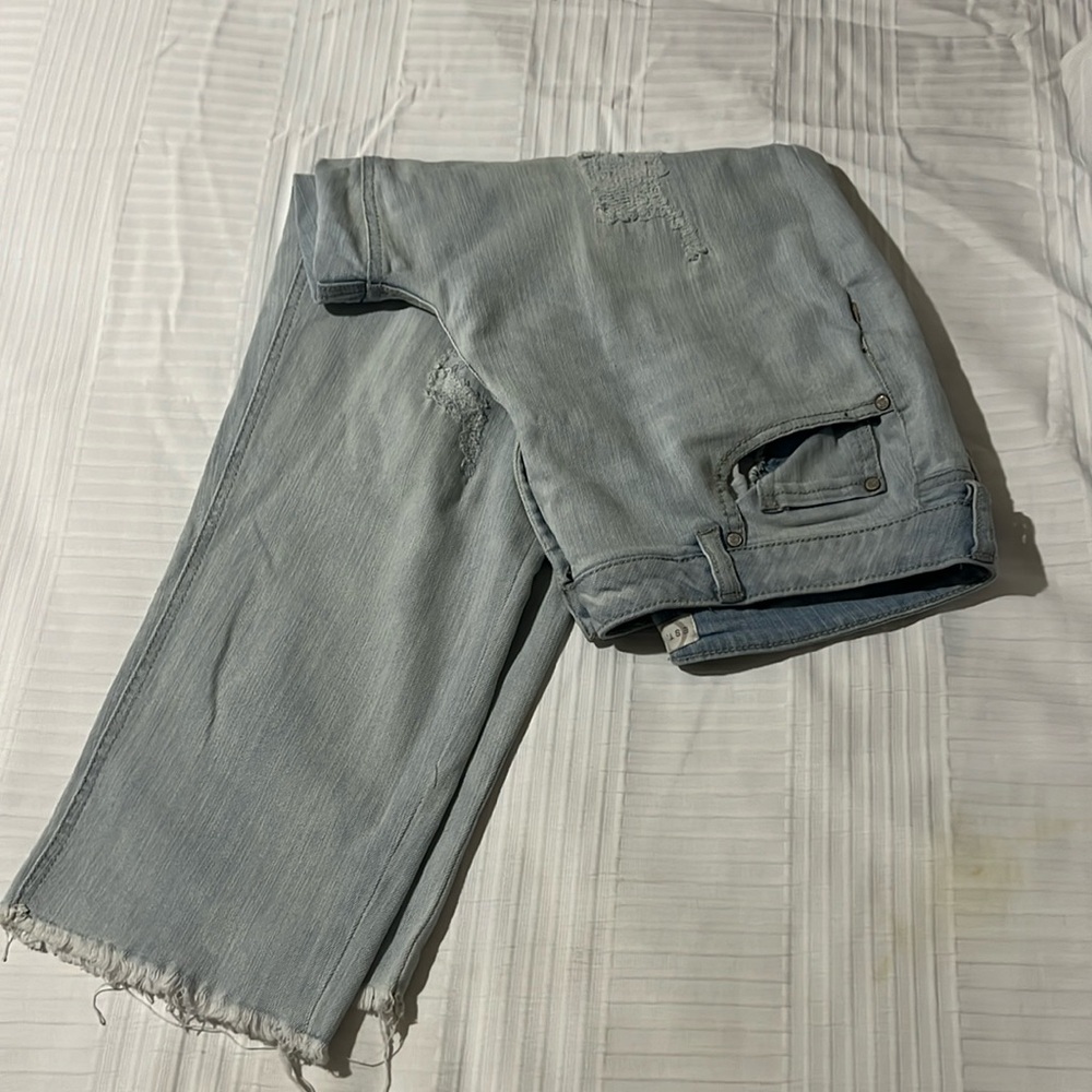 Est 1946 Denim light colored jeans, with ripped marks on front.
